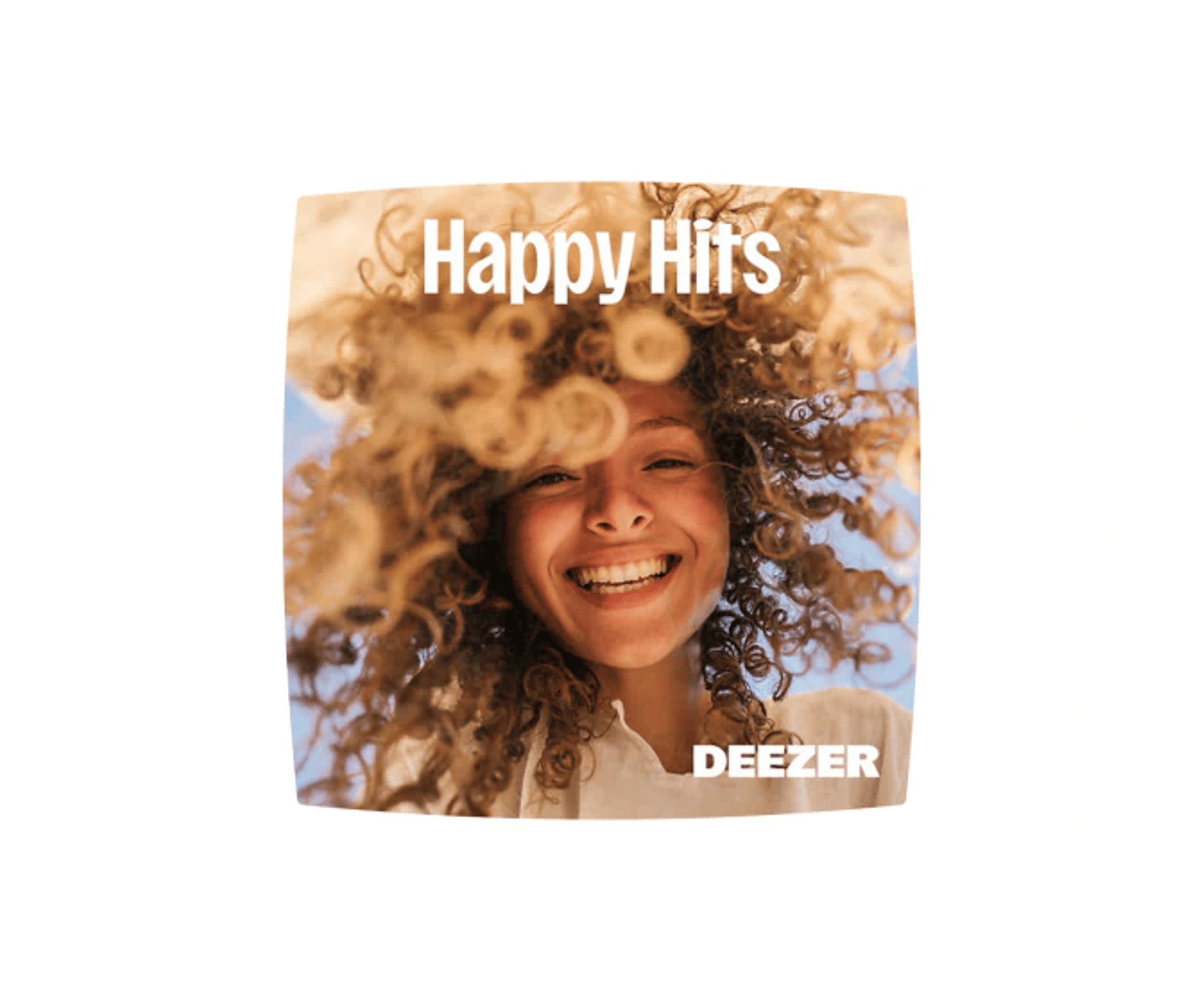 Mobil annonce med Happy Hits og Deezer-logo over et smilende portræt af en person med krøllet hår.