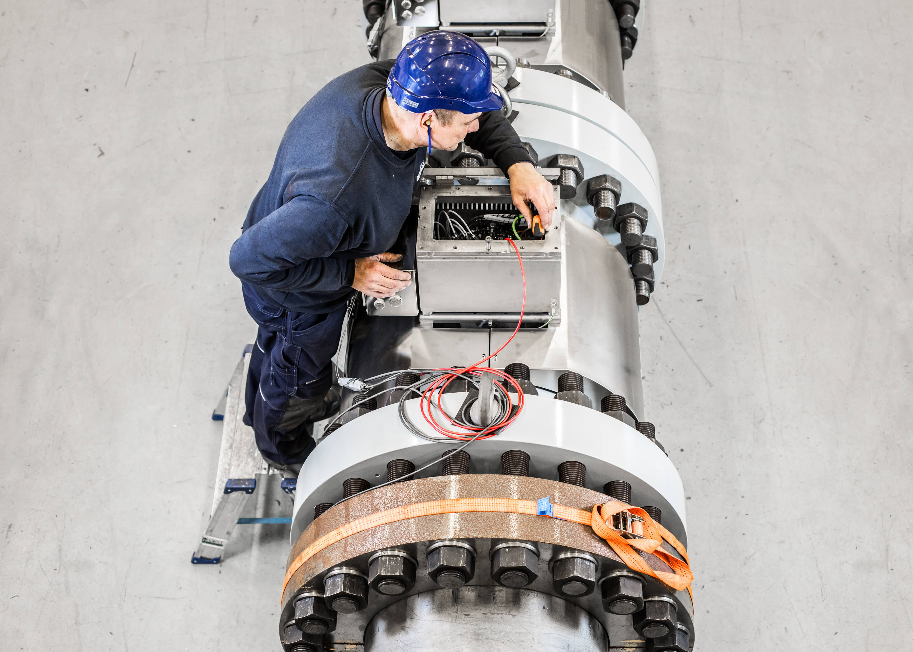 Technician inspecting industrial machinery